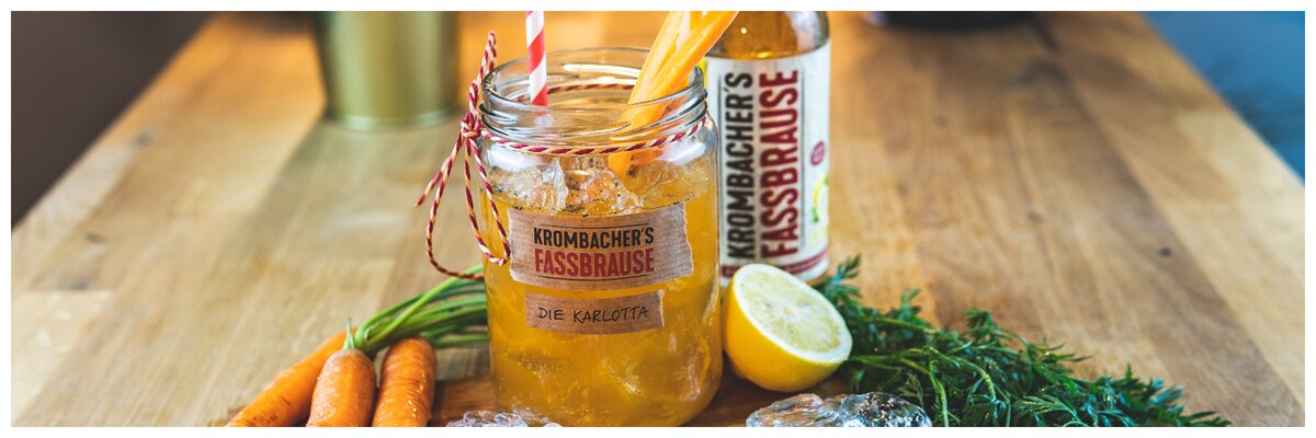 Marmeladengkas mit text: Krombachers Fassbrause Karlotta mit Karotten und Zitronenscheibe