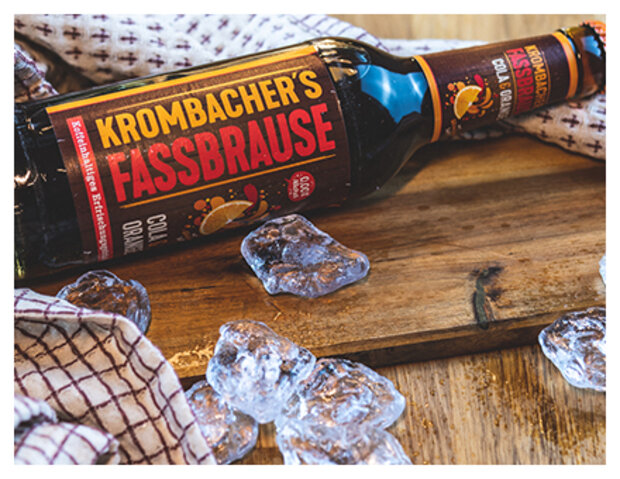 Liegende Krombacher Fassbrause Cola-Orange